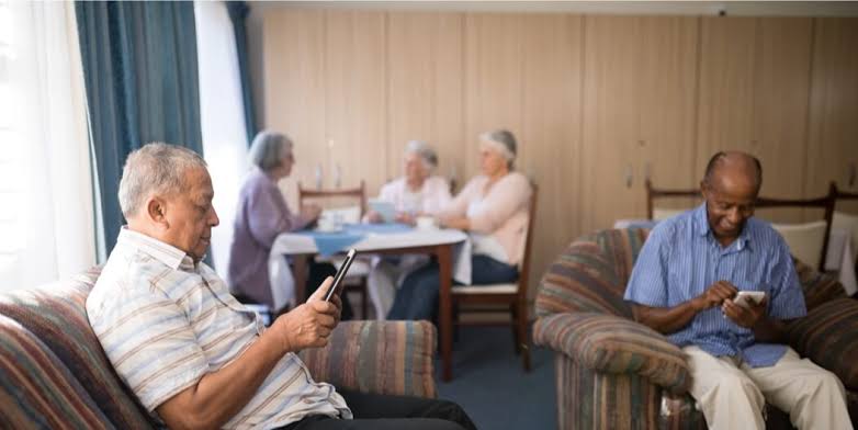 Residents relaxing quietly in the common room